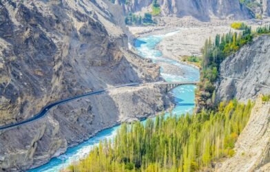 aerial photography of river surrounded by mountains