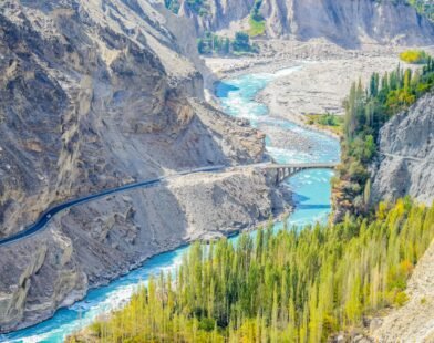 aerial photography of river surrounded by mountains