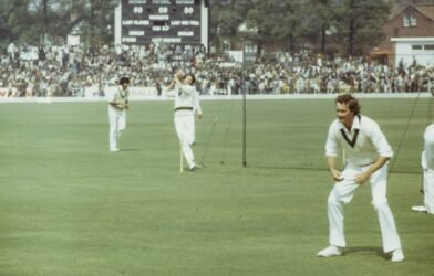 man in white polo shirt and white pants holding golf club